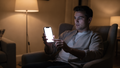 iPhone Mockup — People Armchair Man Evening — bulkmockup Transparent Mockup | PNG Download | Commercial Use | MockupBulk