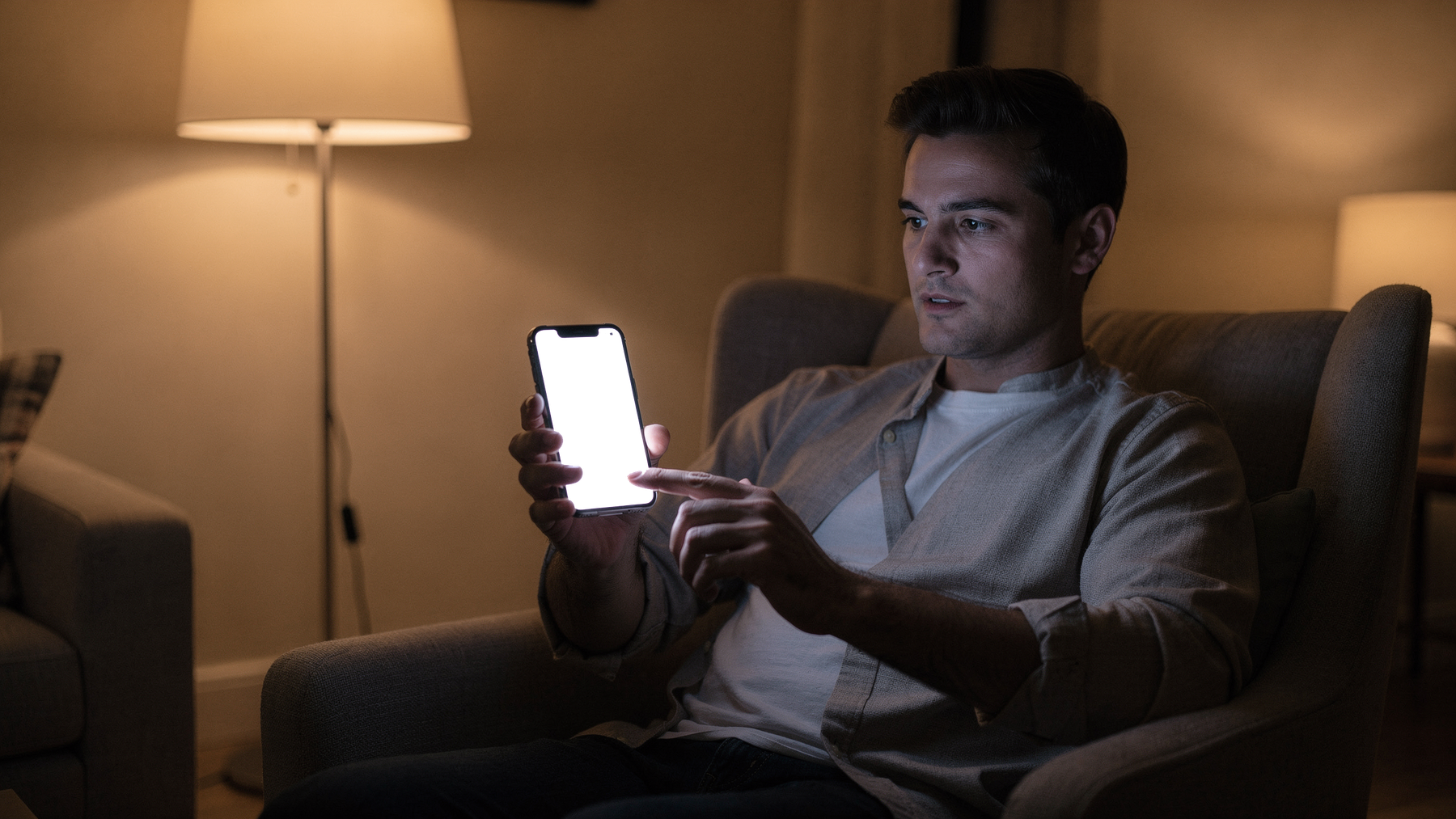 iPhone Mockup — People Armchair Man Evening — bulkmockup Transparent Mockup | PNG Download | Commercial Use | MockupBulk
