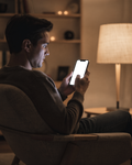 People Armchair Man Evening iPhone Mockup | High-Resolution Transparent PNG | bulkmockup | Commercial Use | MockupBulk