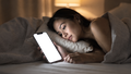 iPhone Mockup — People Bed Woman Side — bulkmockup Transparent Mockup | PNG Download | Commercial Use | MockupBulk