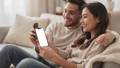 iPhone, People Couch Couple Share | PNG Mockup Template | bulkmockup | For App & Web Designers | MockupBulk