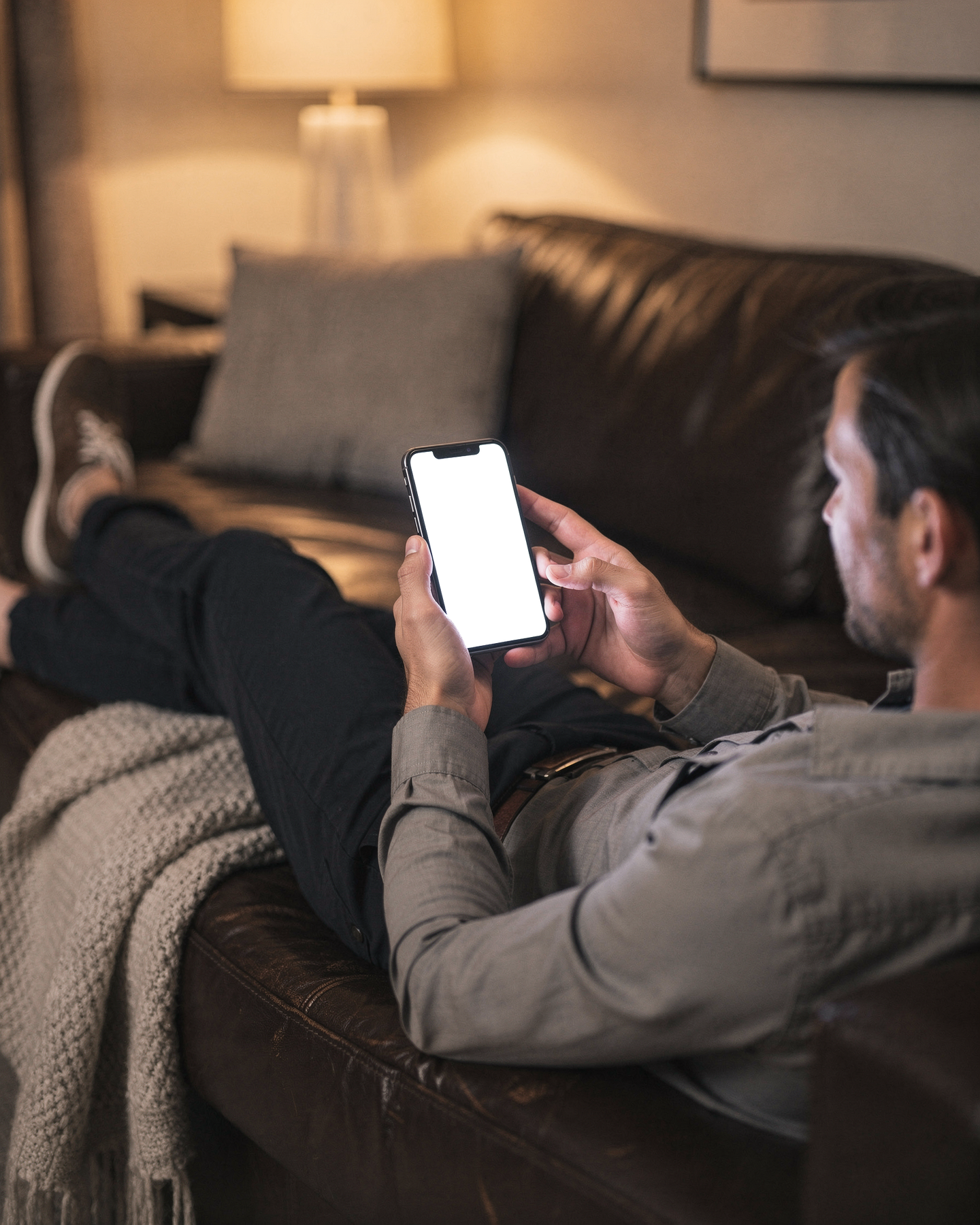 iPhone Mockup — People Couch Man Lounge — Transparent Screen PNG Download | Commercial Licence | bulkmockup
