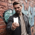 iPhone, People Street Man Leaning | High-Res PNG Mockup | bulkmockup | Commercial Licence | MockupBulk